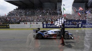 The 2009 Peugeot 908 HDI FAP crosses the finish line of the 24 hours of Le Mans for victory